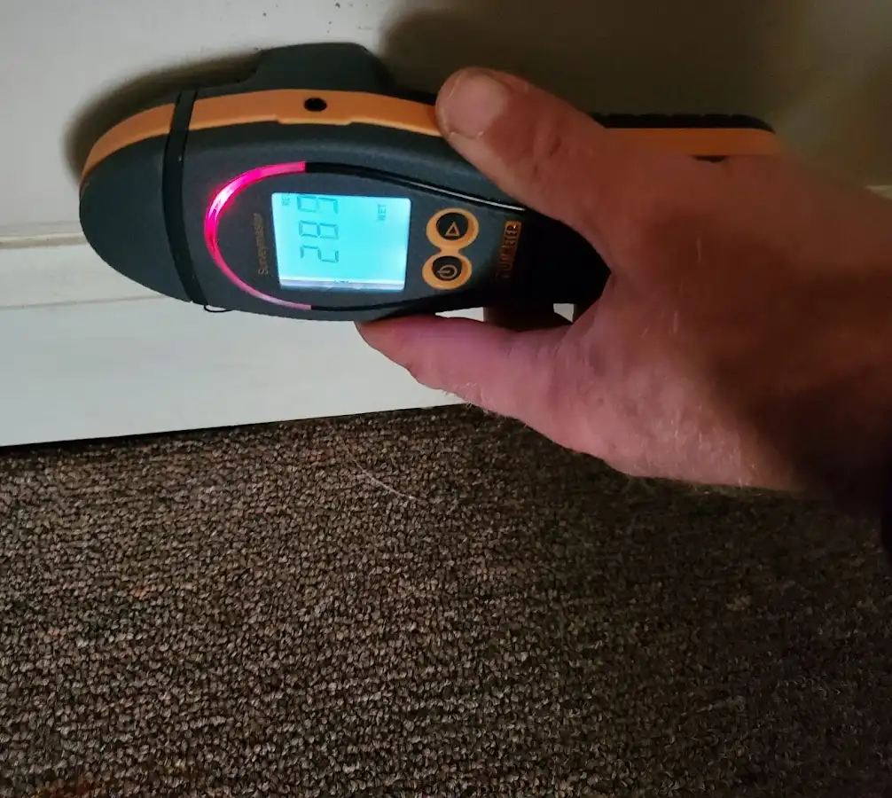 Moisture detection at baseboard during Storm Damage Restoration in Horsham